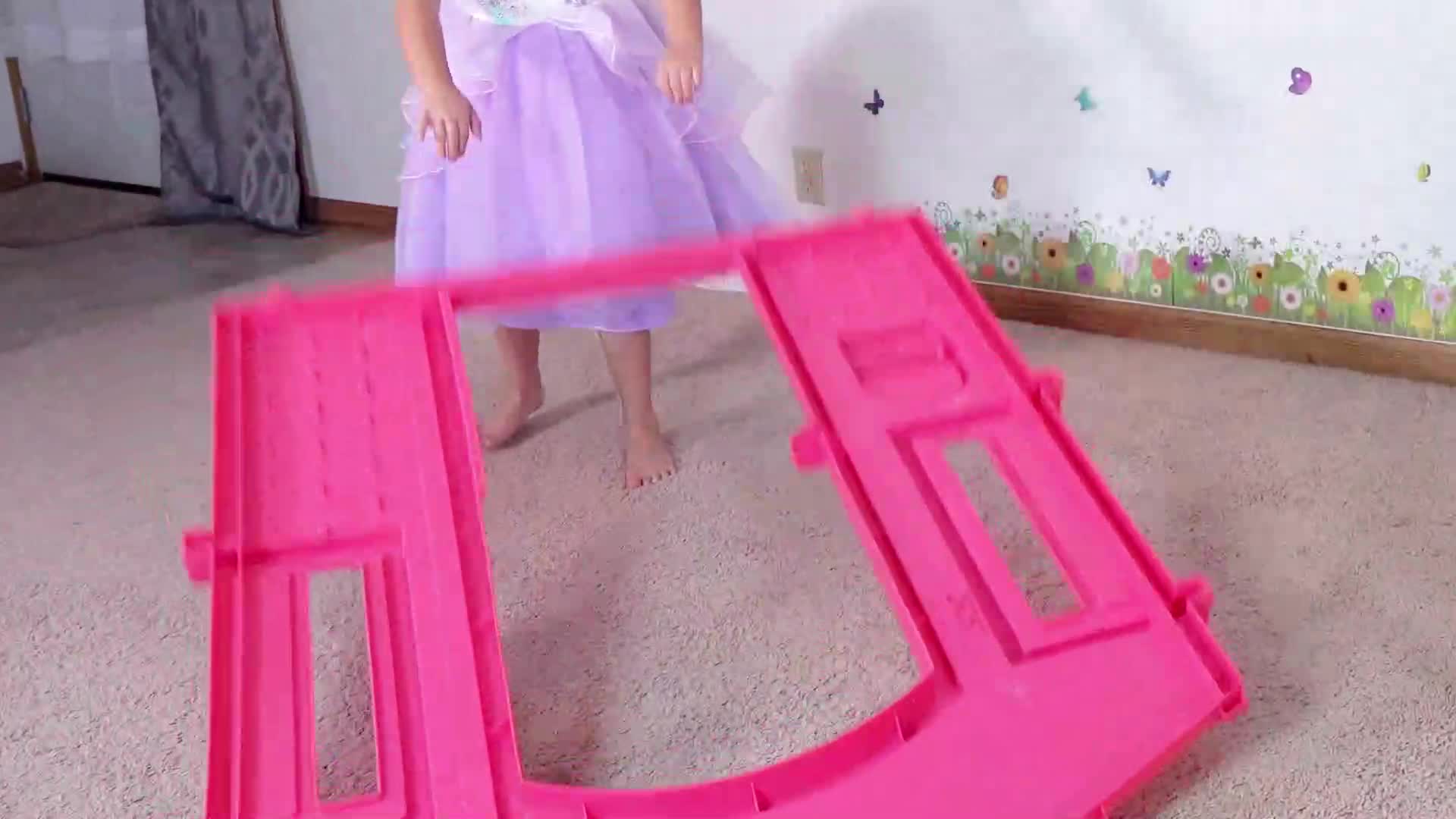 In this animated video, a girl designs and builds her dream toy house with magical, colorful building blocks that snap together on their own!